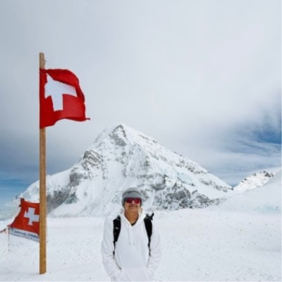 Aarush in Switzerland with mountains in background